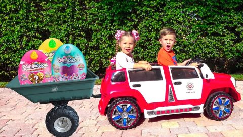 Diana and Roma ride a children's car and find toy surprises