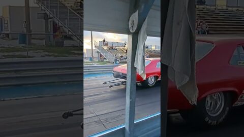 Chevy Nova drag racing against a Ford Fairlane 500