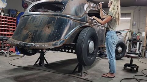Jolene is painting the graphics on her flathead race car (behind the scenes)